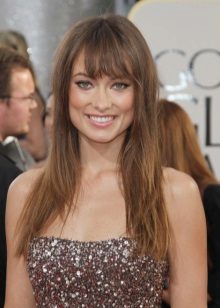 Brown and beige makeup under a chocolate-colored dress