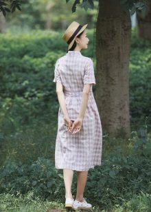 White elongated check shirt dress and hat to it