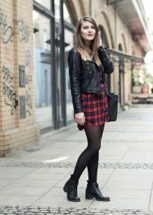 A check dress shirt and a black leather jacket