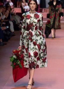 Dress with roses of a simple cut of medium length