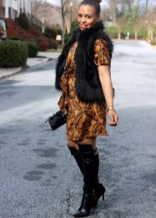 Wrap dress in combination with a fur vest and over the knee boots