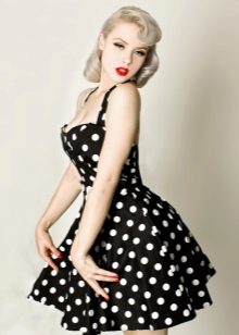 Black dress with white polka dots in retro style.