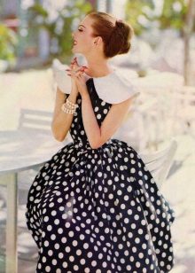 Black dress with white polka dots in retro style.
