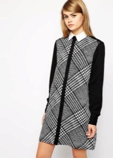 Dress in an oblique black and white check with a white collar and black long sleeves