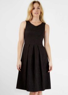 Black pleated dress of medium length