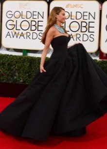 Long black bustier dress with a sun skirt