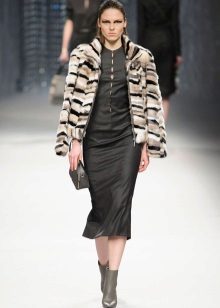 Short fur coat under a winter evening dress