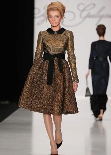brocade dress with a black belt