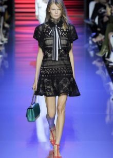 Black lace dress with green accessories