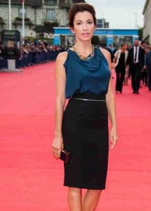 Black pencil skirt in combination with a silk top on straps