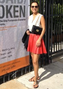 Red leather sun skirt combined with a sleeveless blouse