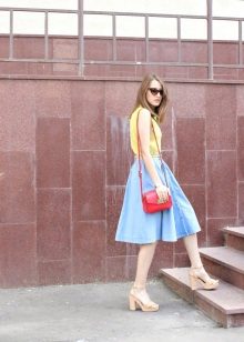 Bright bag in addition to a blue skirt