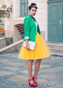 Multi-layered yellow skirt combined with a jacket