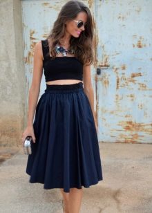 A fluffy skirt below the knee with a short tight top