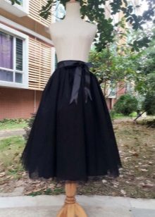 Black midi skirt with a bow on the side