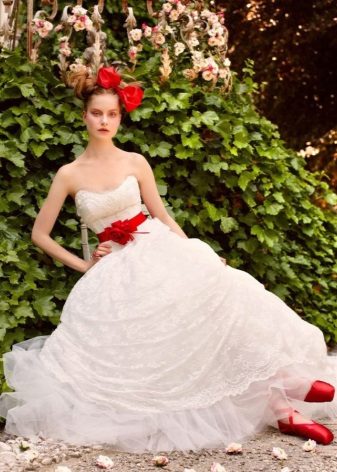 Wedding dress with ribbon and red accessories