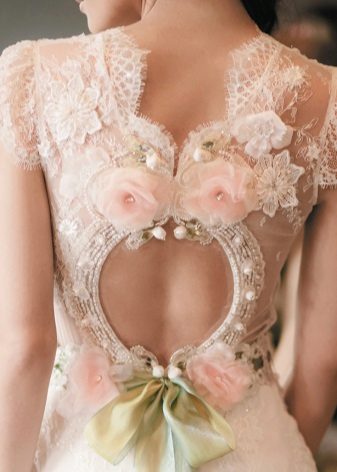 Beautiful decor on the back - a wedding dress with an open back