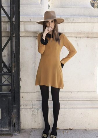 Mustard dress with paid black tights
