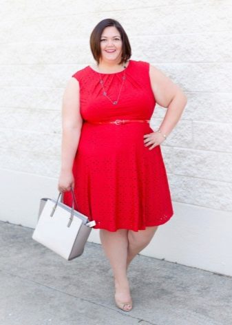 Red sleeveless dress for overweight women with A-shaped silhouette under the red strap