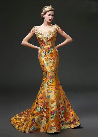 Gold dress in oriental style with national patterns