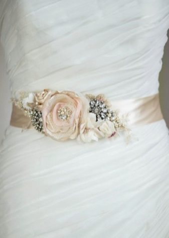 Belt of flowers on a wedding dress