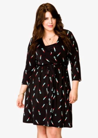 Black knitted dress with not a large pattern for a full girl