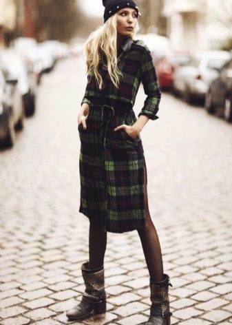 A warm green check shirt dress combined with 5 cm high heels and a hat with a twist