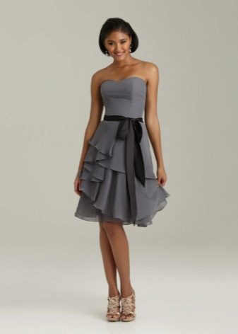 Dress with asymmetrically sewn flounces on a skirt