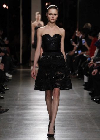 Black dress bustier with a mid-length bell skirt