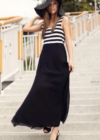 A half-sun skirt in combination with a striped T-shirt and hat