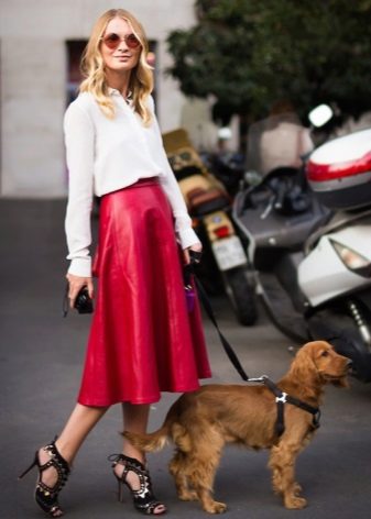 Bright red midi-length leather skirt sun