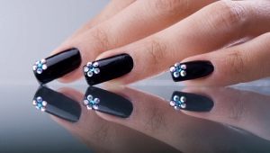 Black manicure with rhinestones - shine and mystical mystery