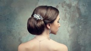 Collected hairstyles for the wedding: beautiful high styling with a veil, diadem and crown