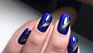 Cat eye manicure in blue shades