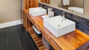 Wooden tabletop in the bathroom: a description of the types, tips for choosing and care
