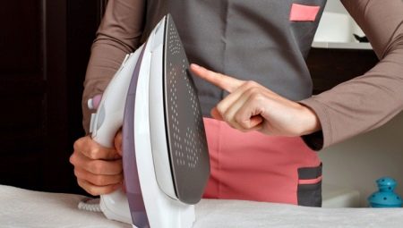 How to clean a teflon-coated iron from burnt cloth?