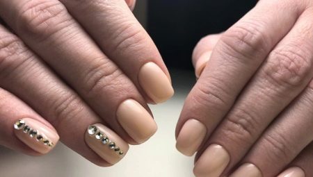 Beautiful manicure with gel polish in nude shades