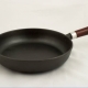 How to clean a cast-iron pan from soot at home?