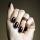 Design and decor of dark manicure