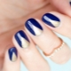 Design of blue manicure with gold