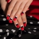 Unusual ideas of manicure in a combination of white, red and black tones