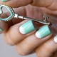 The combination of white and turquoise colors in a manicure