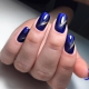 Cat eye manicure in blue shades