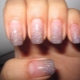 Manicure with sparkles on the tips of the nails.