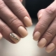 Beautiful manicure with gel polish in nude shades