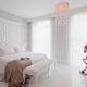 White curtains in the bedroom interior
