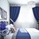 The use of blue and blue curtains in the interior of the bedroom