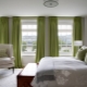 Features of using green curtains in the bedroom interior