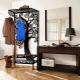 Wrought iron hangers in the hallway: varieties and selection tips