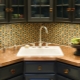 Kitchens with a sink in the corner: the pros and cons, examples in the interior